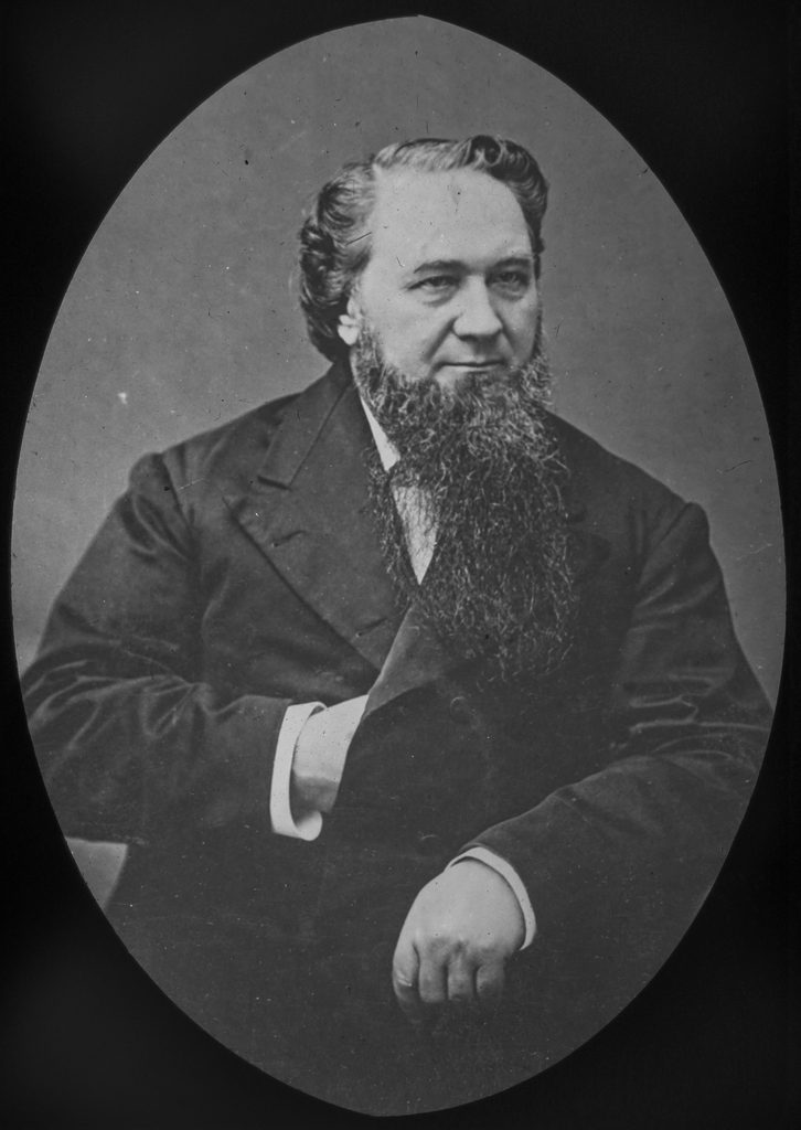 Portrait of a bearded man in 19th-century attire, showcasing a serious expression and historical significance.