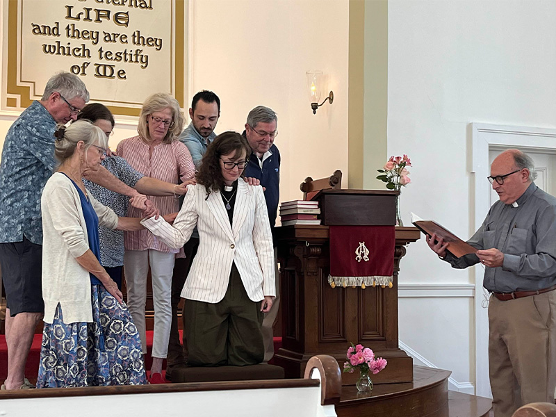 Six members of the church’s executive board laid hands on Rev. Alison during the installation ceremony.